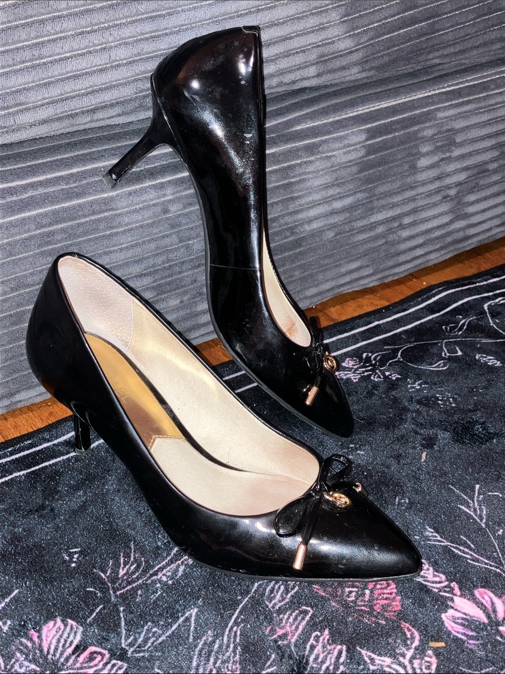 MICHAEL Michael Kors Black Patent Pointed-Toe Pumps with Bow and Gold Logo